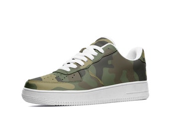 May include: White low-top sneakers with a camouflage pattern. The sneakers have a white sole and laces.