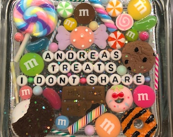 May include: A clear square resin tray filled with colorful candies, chocolate, and sprinkles. The tray has a white background with the words "ANDREAS TREATS I DON'T SHARE" in black letters.