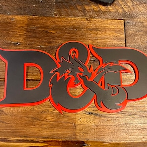 May include: Black and red wooden sign with the letters "D&D" and a dragon design.