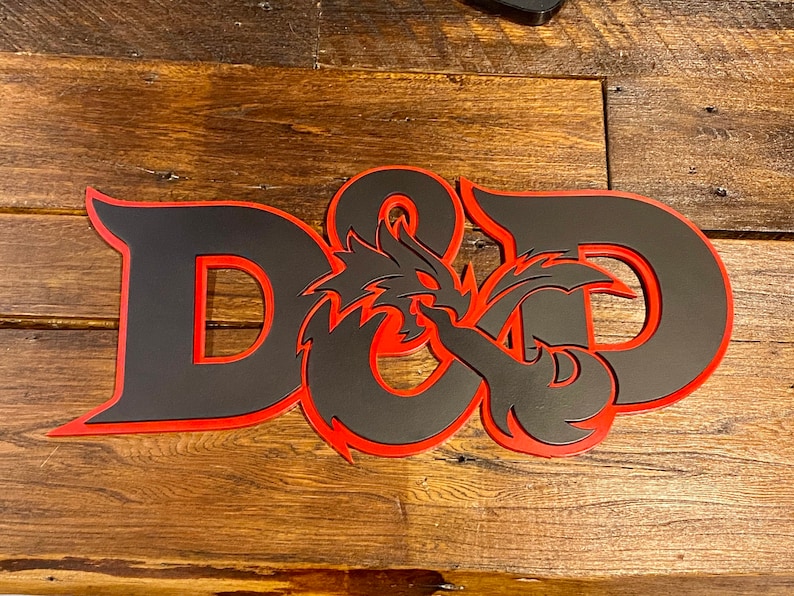 May include: Black and red wooden sign with the letters "D&D" and a dragon design.