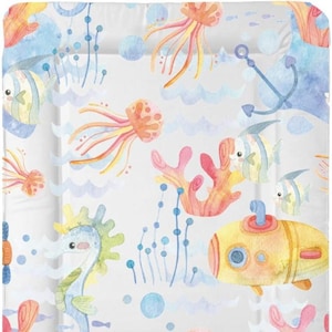 May include: A watercolor illustration of a colorful underwater scene with a yellow submarine, seahorses, jellyfish, coral, and fish. The background is a light blue with white waves.