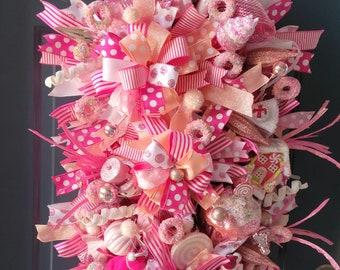 Whimsical pink christmas swag, candy and sweets wreath, snowman and gingerbread xmas swag