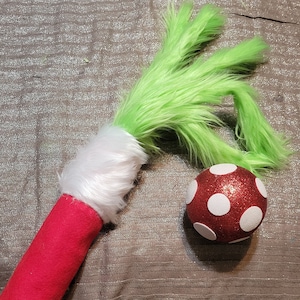 Christmas green monster furry arm tree topper, furry green arm with ornament pick