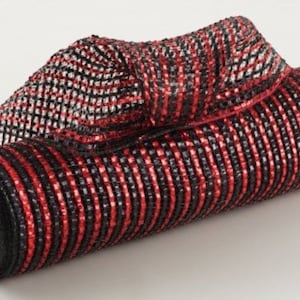 May include: Red and black striped metallic mesh ribbon. The ribbon is rolled up and has a black core.