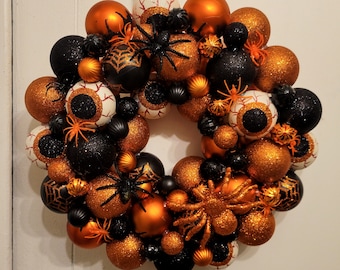 Orange and black Halloween ornament wreath, eyeballs and spiders wreath