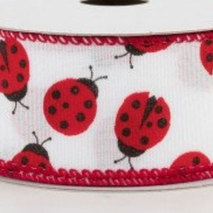 May include: White ribbon with a red trim and a repeating pattern of red ladybugs with black spots.