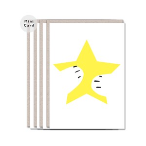 May include: A set of four mini cards featuring a yellow star design. The star has black lines on the points and is surrounded by white space.