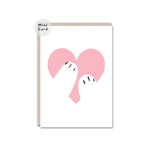May include: A pink heart held by two white hands. The hands have black eyes and small black lines for fingers.