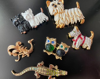 Assorted vintage brooches. Each sold separately.