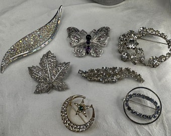 Assorted vintage brooches. Each sold separately.