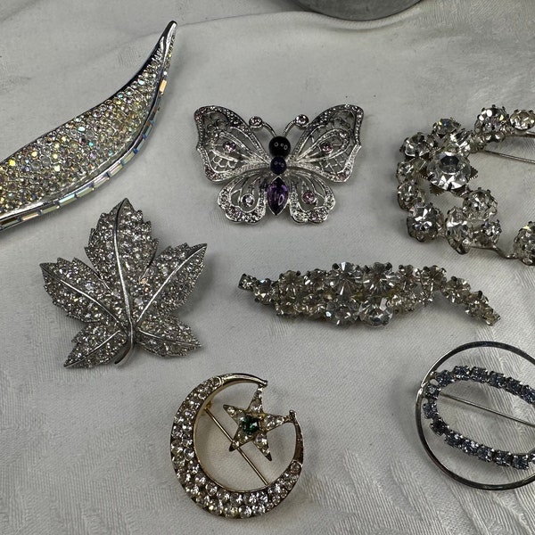 Assorted vintage brooches. Each sold separately.