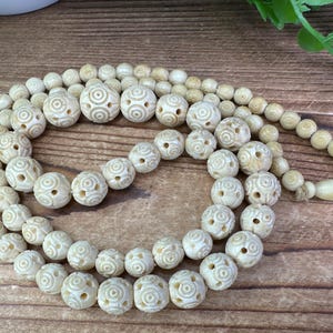 Vintage carved bovine bead long necklace