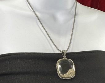Vintage silver and diamond shaker pendant on crystal filled mesh chain