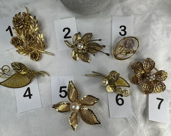 Assorted vintage brooches. Each sold separately.