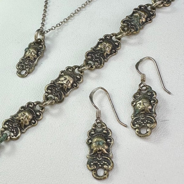 Antique Victorian Chatelaine converted to bracelet, earrring and pendant set. Electro plated nickel silver.