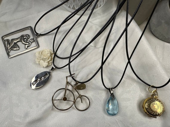 Assorted fashion pendants on black cord necklaces… - image 1