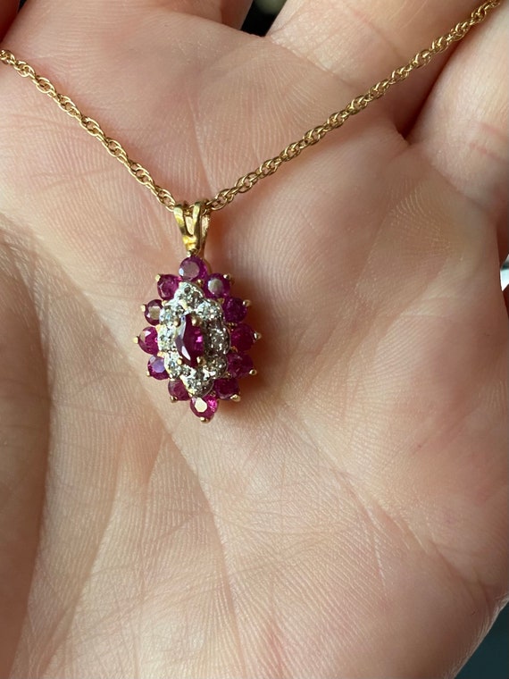 Vintage 10kt yellow gold pendant with rubies and genuine diamonds on yellow gold rope chain.
