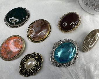 Assorted vintage brooches. Each sold separately.