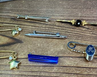 Assorted bar and safety pin style vintage brooches. Each sold separately.