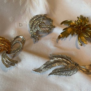 Assorted vintage Coro/ CoroCraft brooches. Each sold separately.