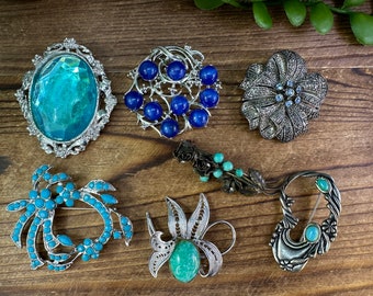 Assorted Vintage blue stone, bead, rhinestone Brooches. Each sold separately.