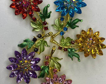 Rhinestone flower brooches. Assorted colors. Each sold separately.