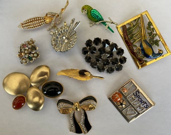 Assorted vintage brooches. Each sold separately.