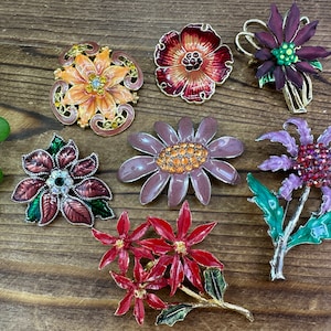 Assorted flower vintage brooches. Each sold separately.