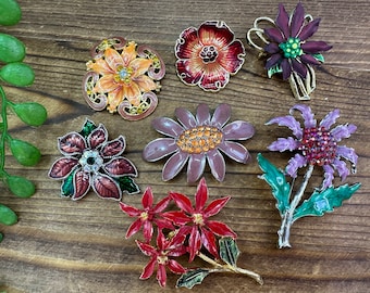 Assorted flower vintage brooches. Each sold separately.
