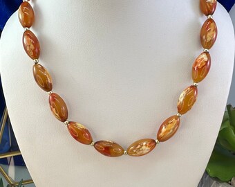 Vintage bead necklace with orange and white beads