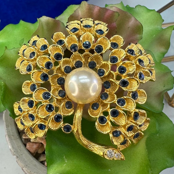 Signed Alana Stewart flower brooch with blue stones and pearl