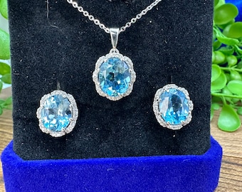Blue Topaz and sterling silver necklace, pendant and earring set.