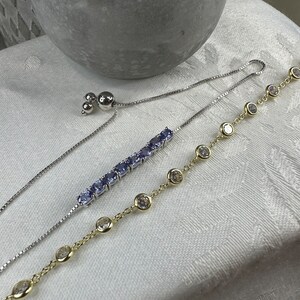 925 Silver bracelets- one tanzanite one with cubic zirconium- each sold separately