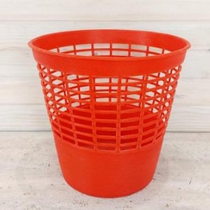 Vintage orange wastepaper basket, plastic trash can, retro waste basket