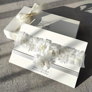 Wedding garter set with gift packaging.