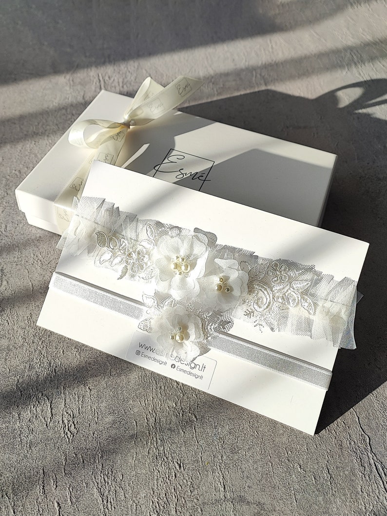 Wedding garter set with gift packaging.