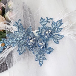 Blue wedding garter with feathers