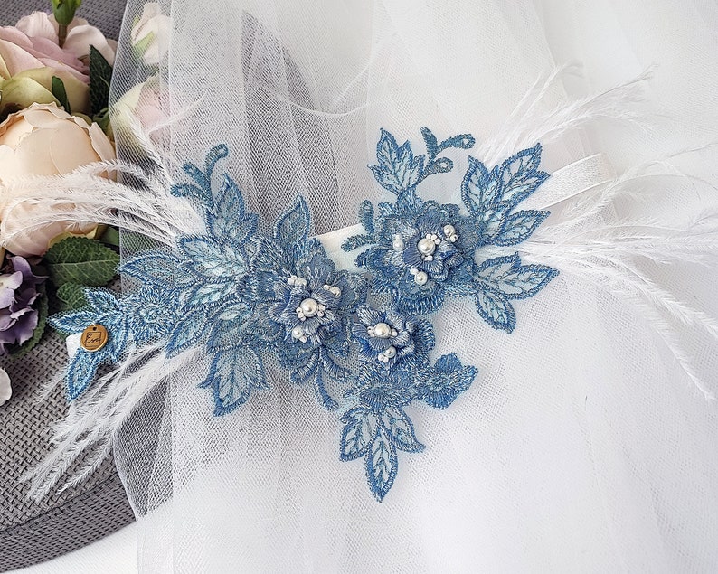 Blue wedding garter with feathers