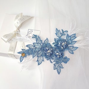 Blue wedding garter with feathers