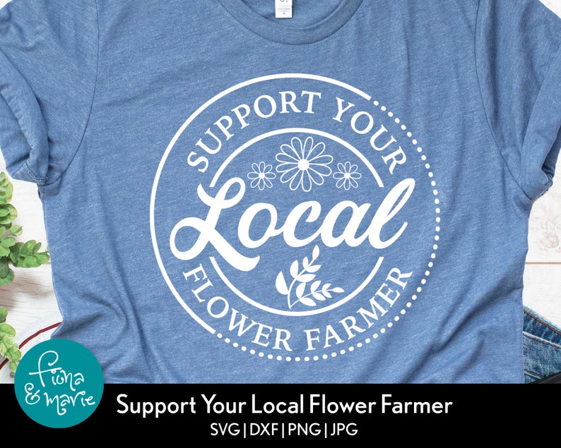 May include: A blue t-shirt with a white circle design that says "Support Your Local Flower Farmer" with stylized flowers and leaves.