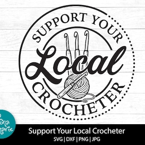 May include: A black and white circular graphic with the text "SUPPORT YOUR LOCAL CROCHETER". The design features crochet hooks, a ball of yarn, and the Fiona & Marie logo. The words "Support Your Local Crocheter" are at the bottom.