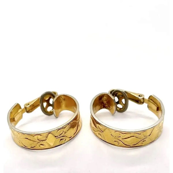 Crown Trifari gold tone wide hoop mid century clip on earrings with embossed design