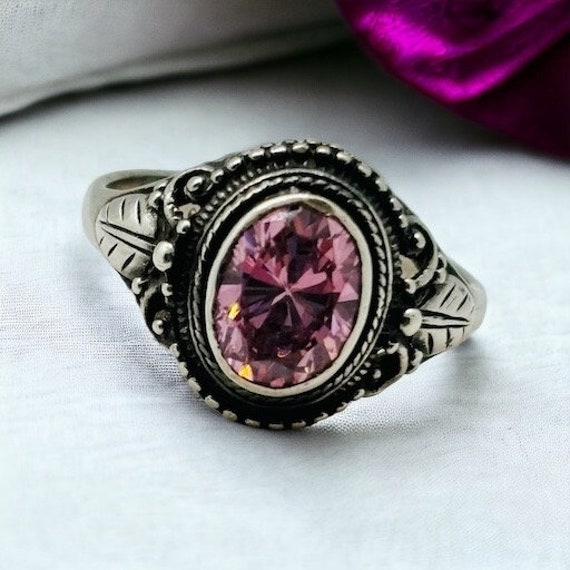 Sterling silver and bezel set pink cubic zirconia 