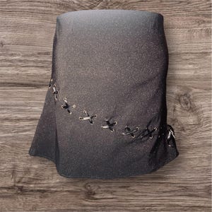 Black asymmetrical hem skirt with bronze glitter