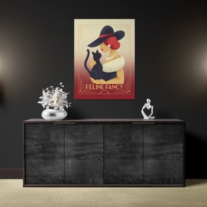 May include: A vintage-style illustration of a woman in a red dress and a black hat holding a black cat. The text "FELINE FANCY" is written in gold lettering on a red background.