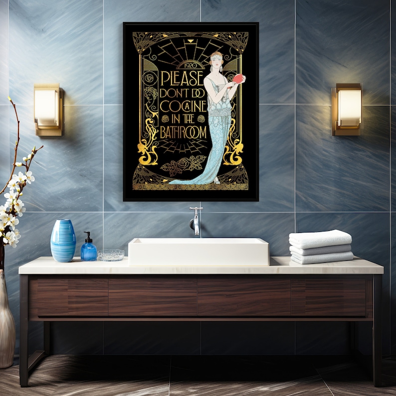 May include: Art Deco style framed print with a black background and gold accents. The print features a woman in a flowing gown and the text "PLEASE DON'T DO COCAINE IN THE BATHROOM."