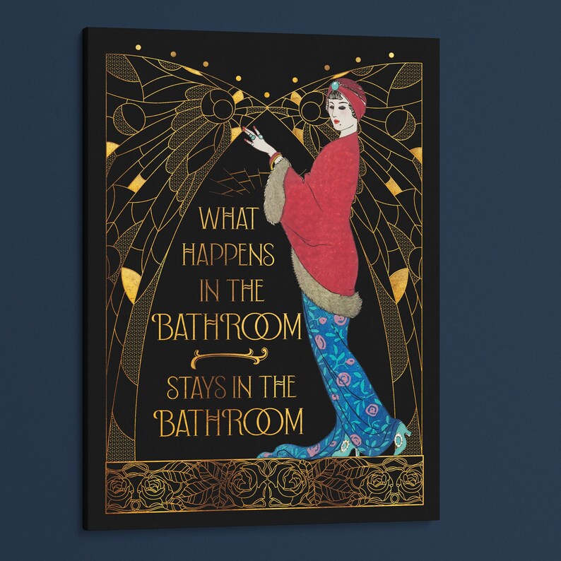 May include: A black and gold art print with a woman in a red and blue dress. The text reads "What happens in the bathroom stays in the bathroom."
