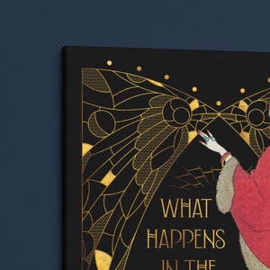 May include: A black and gold art print with a woman in a red dress and a gold butterfly design. The text "What Happens in the Dark" is printed on the bottom of the print.