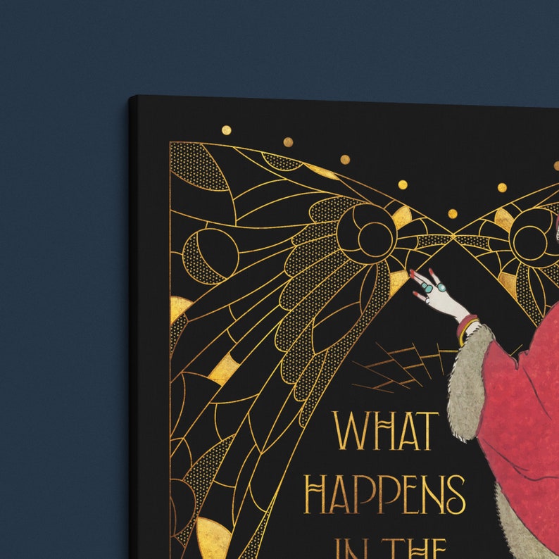 May include: A black and gold art print with a woman in a red dress and a gold butterfly design. The text "What Happens in the Dark" is printed on the bottom of the print.