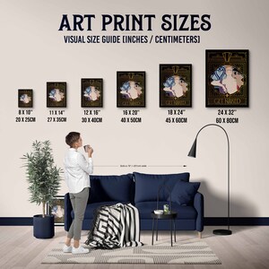 May include: A visual guide showing different sizes of art prints, with a person standing in front of a couch to show scale. The prints feature a black and gold design with the text "Get Naked". The sizes are 8x10 inches (20x25 cm), 11x14 inches (27x35 cm), 12x16 inches (30x40 cm), 16x20 inches (40x50 cm), 18x24 inches (45x60 cm), and 24x32 inches (60x80 cm).